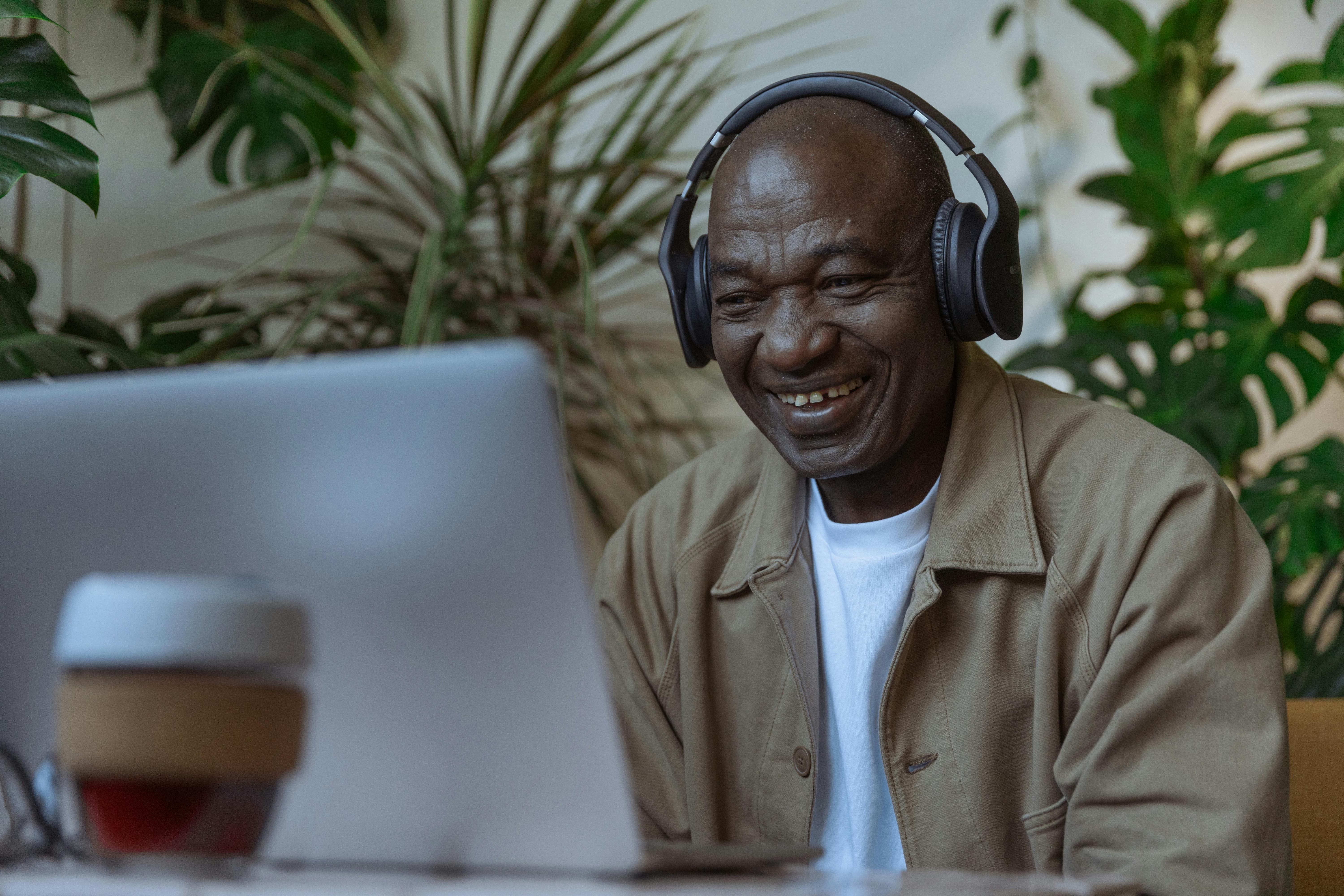 Senior man laughing during a video call